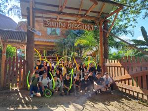 a group of people posing for a picture in front of a building at Fundo Hassinger in Oxapampa