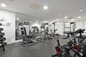 a gym with several treadmills and exercise bikes at Deluxe City Centre Studio Apartment with Balcony & City Views - FREE WIFI NETFLIX, GYM ACCESS - WESTONE in Sheffield