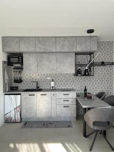 a kitchen with a sink and a table in it at Zagreb Lux apartment in Zagreb