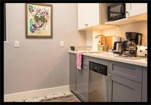 a kitchen with a sink and a dishwasher at 3BR Central Park in New York