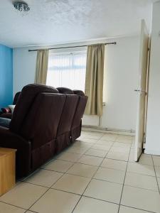 a living room with a couch and a window at semi-detach in Saint Helens