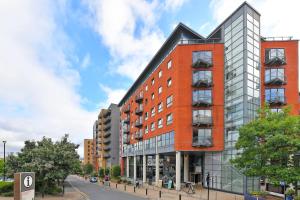 a red brick building on the side of a street at Deluxe City Centre Studio Apartment with Balcony & City Views - FREE WIFI NETFLIX, GYM ACCESS - WESTONE in Sheffield