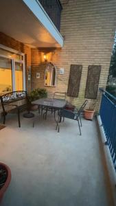 a patio with a picnic table and a bench at Luxury apartment in Bournemouth in Bournemouth