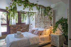 a bedroom with a bed with ivy on the wall at Exclusive 6 bed, 6 bath residence in Old Montreal in Montréal