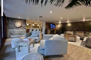 a large living room with couches and a tv at Exclusive 6 bed, 6 bath residence in Old Montreal in Montréal
