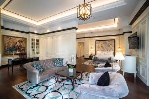 a living room with a couch and a bed at InterContinental Bali Resort by IHG in Jimbaran