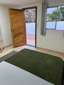 A bed or beds in a room at HOSTEL DA LAPINHA