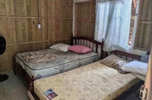 Postel nebo postele na pokoji v ubytování San blas cabaña en isla del barco hundido