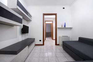 a living room with two beds and a hallway at Dogana Ponte Chiasso G e P 2 in Como