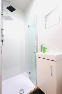 a bathroom with a shower and a sink at Studio 22 Lower Road Beeston in Nottingham