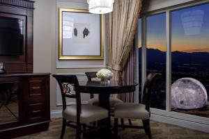 a dining room with a table and chairs and a window at The Venetian® Resort Las Vegas in Las Vegas