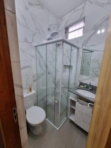 a bathroom with a shower and a toilet and a sink at Studio fantástico in São Paulo +24 photos