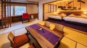 Cama ou camas em um quarto em Hotel Taisetsu Onsen&Canyon Resort