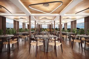 a rendering of a restaurant with tables and chairs at Protea Hotel by Marriott Luanda in Luanda