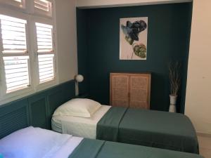 Letto o letti in una camera di Villa Diamant Bleu