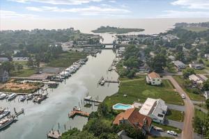 an aerial view of a river with houses and boats at Waterfront Bliss- Ultimate Tilghman Retreat home in Tilghman