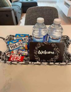 a basket of snacks and water bottles on a table at 1BR Condo DWTN Toronto - free Parking, Gym & Pool in Toronto