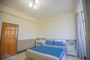Ένα ή περισσότερα κρεβάτια σε δωμάτιο στο 卡薩行旅壹館 包棟民宿