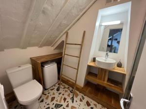 a bathroom with a toilet and a sink at Lovely flat 20min from Champs Élysée, 10min from Stade de France in Saint-Denis