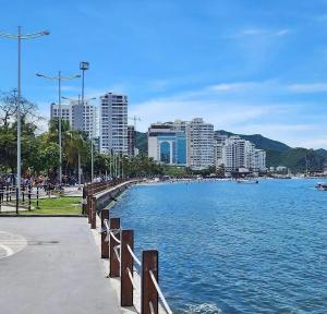 a large body of water next to a city with buildings at Santa Sophia Del Mar B&B hotel in Santa Marta
