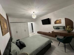 a bedroom with a large bed and a mirror at Luxury apartment , Private parking, Self Check-in64 in Craiova