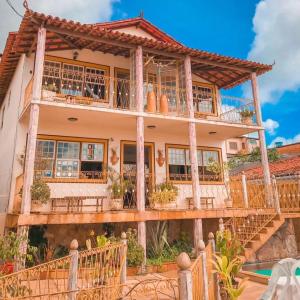 a house with balconies on the side of it at Hotel Montanhas de Minas in Diamantina