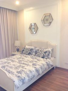 Un pat sau paturi într-o cameră la My Resort Hua Hin A310