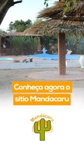 a sign for a hotel with a picture of a resort at Sítio Mandacaru na Chapada Diamantina in Seabra