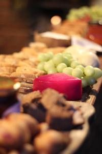 a tray of different types of pastries and grapes at Sítio Mandacaru na Chapada Diamantina in Seabra