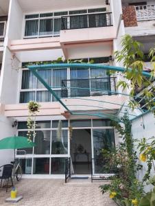 an external view of a building with a balcony at Smart Hostel in Bangkok