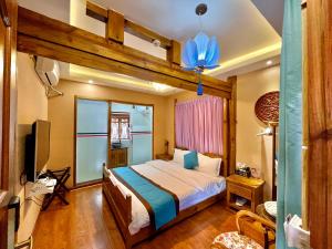 Ένα ή περισσότερα κρεβάτια σε δωμάτιο στο Juxian Boutique Homestay
