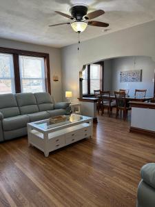 a living room with a couch and a table at New 3 Bedroom City Escape in Saint Louis