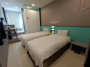 Letto o letti in una camera di Walker-Taoyuan