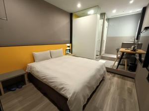Letto o letti in una camera di Walker-Taoyuan