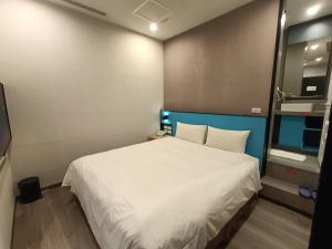 Letto o letti in una camera di Walker-Taoyuan