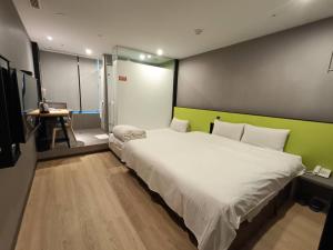 Letto o letti in una camera di Walker-Taoyuan