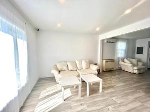 a living room with a couch and a table at Aubin Paradise Housing in Windsor