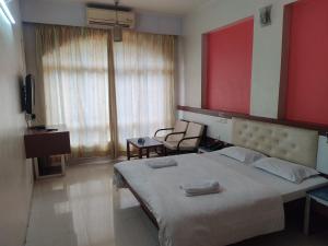 Hotel Rajtara客房内的一张或多张床位