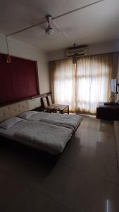 Hotel Rajtara客房内的一张或多张床位