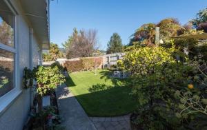 a view of a garden with trees and a lawn at Sunny Richmond Retreat in Richmond