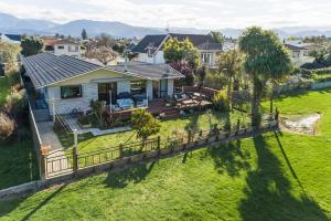 an aerial view of a house with a yard at Stay and Play in Motueka in Motueka