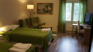 Postel nebo postele na pokoji v ubytování Hotell Vindelngallerian