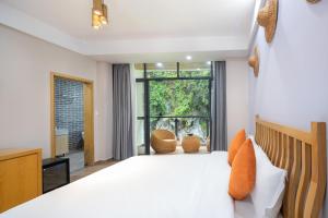 מיטה או מיטות בחדר ב-Qingshan Yuandai Boutique Homestay Yangshuo