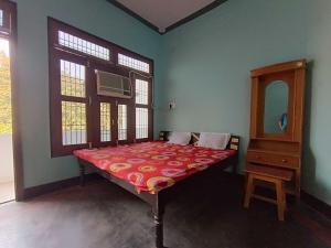 Postel nebo postele na pokoji v ubytování Hotel O Home Madhav Homestay