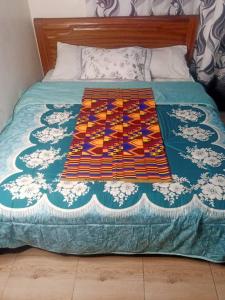 En eller flere senge i et værelse på RusticHome B&B, Kigali