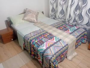 En eller flere senge i et værelse på RusticHome B&B, Kigali