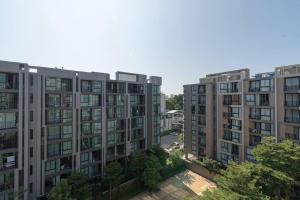 an aerial view of apartment buildings in a city at Modern Condo in Nimman (F806) by Pimolplace in Chiang Mai