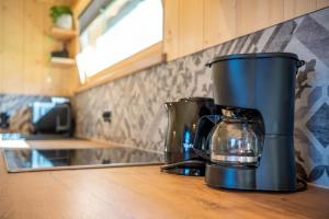 a coffee maker sitting on a counter in a kitchen at Gloans Glück Ferienhaus in Frasdorf