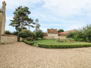 an external view of a house with a garden at The Coach House in Grantham