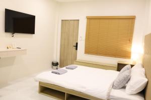 Katil atau katil-katil dalam bilik di S.P.C Apartment by Brodderud